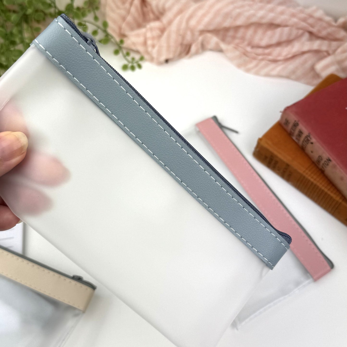 Pencil cases, frosted PVC with coloured zip closure